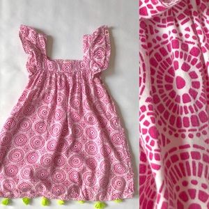 Pink  flutter sleeve dress with lime green tassels